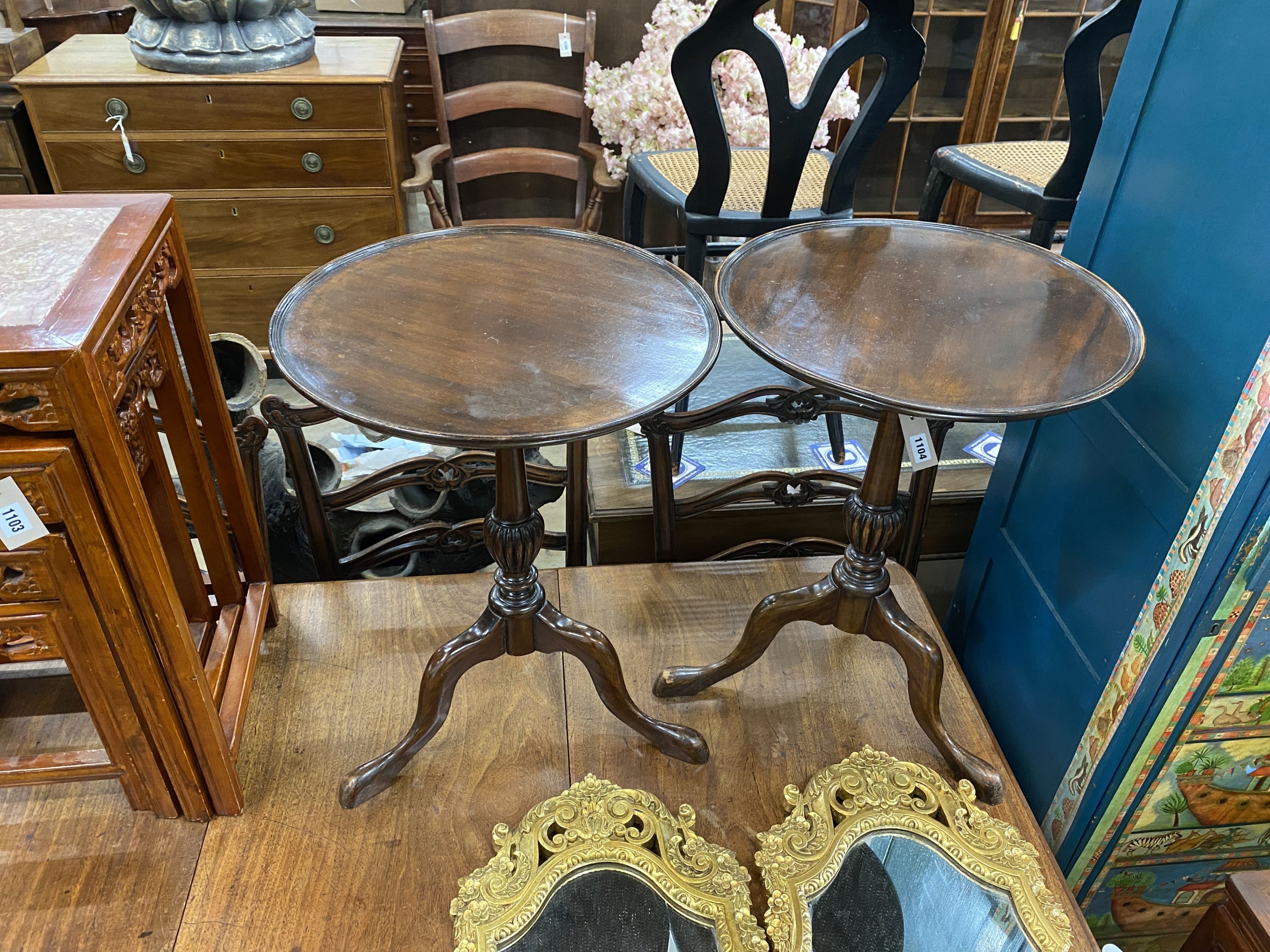 A pair of George III style circular mahogany tripod wine tables, diameter 45cm, height 59cm